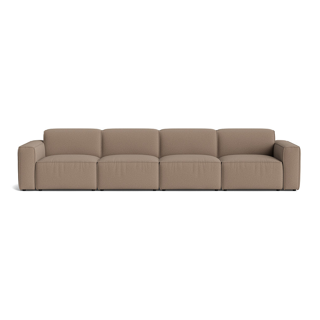 Element modulsofa i beige farve, elegant design med organiske linjer til moderne indretning.